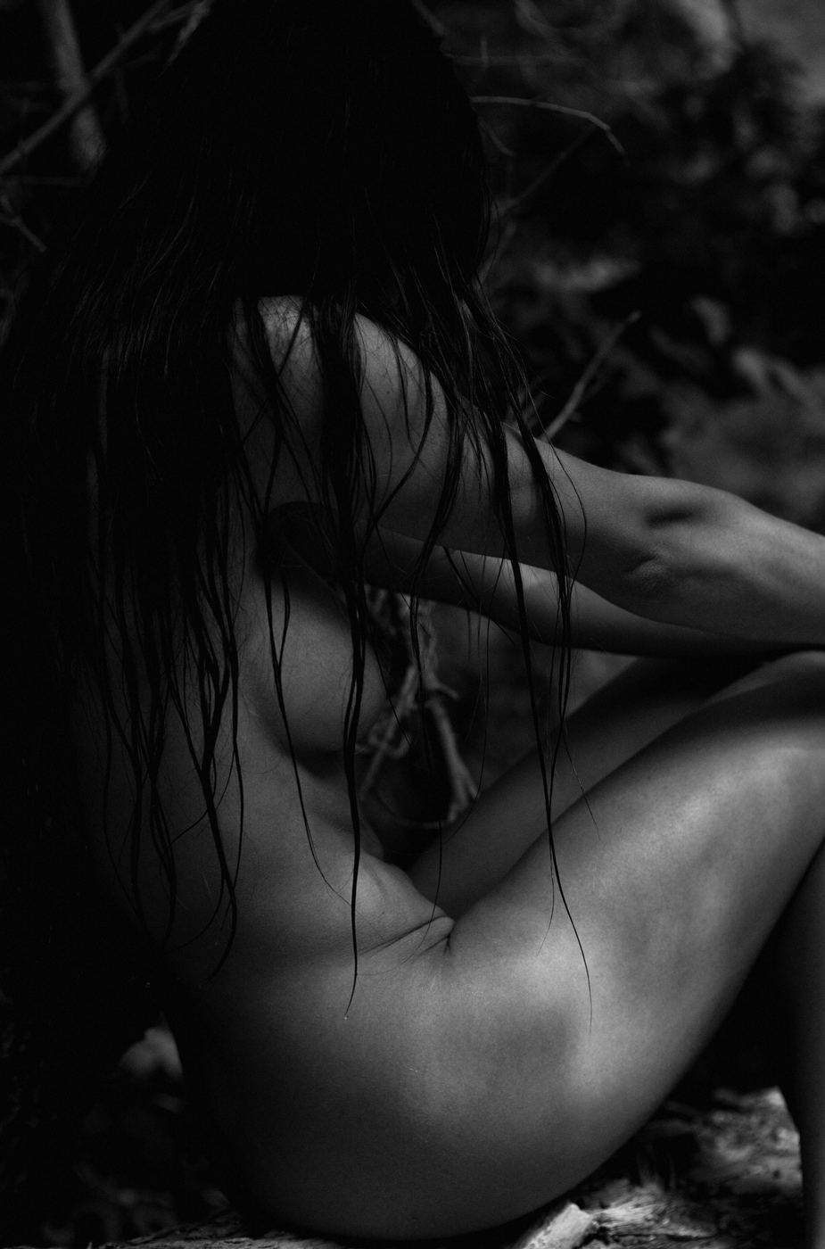 Dark moody black and white portrait of a woman with wet hair, by ARMAND